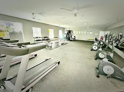 a gym with rows of exercise equipment in a room at Ipoh Manhattan Waterpark 3BR 8Pax Suite by City Home Empire MHA304 in Ipoh