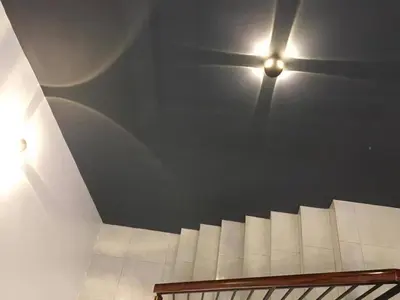 a staircase with a light on the ceiling at Homestay sweet dream in Gua Sai