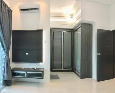 a living room with a flat screen tv on a wall at Homestay sweet dream in Gua Sai