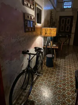 a bike parked against a wall in a room at Bitterswiit Ladies Hostel in George Town