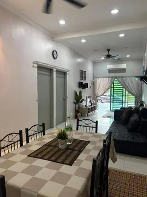 a living room with a couch and a table at Homestay Sakinah No 39 in Tanjung Malim