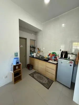 a kitchen with a refrigerator and a sink in it at AYAAN Muslimah home at Golden Hill near Night Market in Brinchang