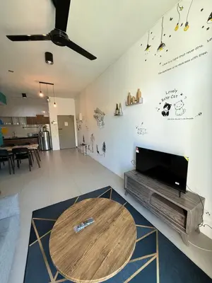 a living room with a wooden table and a tv at AYAAN Tulip Golden Hills Home Near Night Market Free Parking in Brinchang