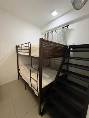 a room with two bunk beds and a staircase at AYAAN Tulip Golden Hills Home Near Night Market Free Parking in Brinchang