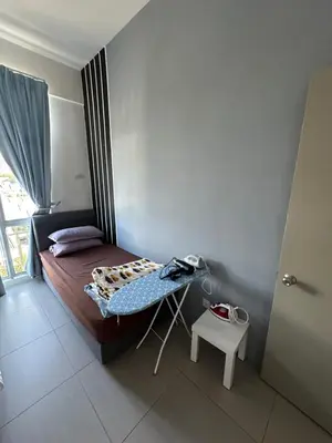 a small bedroom with a bed and a table at AYAAN PENTHOUSE at Golden Hill Night Market View in Brinchang