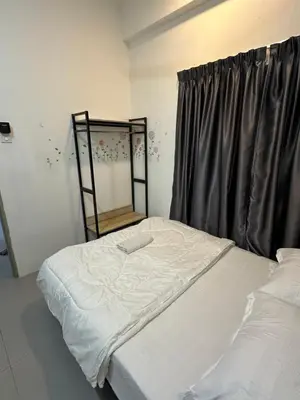 a bed in a room with a window at AYAAN Lavender Home at Golden Hills near Night Market in Brinchang