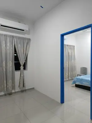 a room with a mirror and a bed and a window at Villa Atok Opah in Teluk Intan
