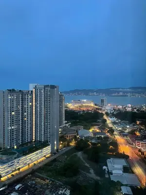 a view of a city with buildings and the water at Woodsbury Suites Butterworth in Butterworth