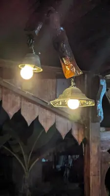 two lights hanging from a ceiling in a room at Abadi's Homestay in Tanjung Karang