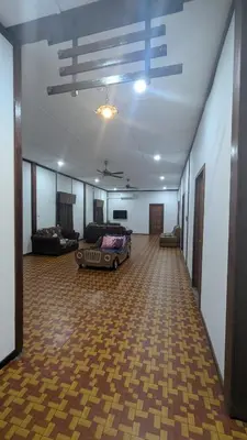 a large room with a couch and a car in it at Abadi's Homestay in Tanjung Karang