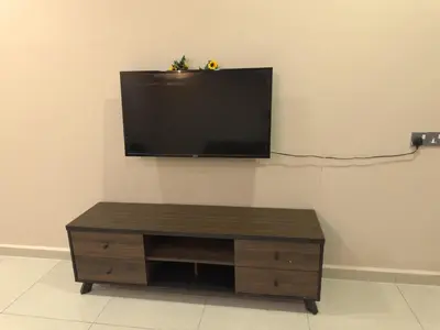 a flat screen tv hanging on a wall at MM HomeStay 82 in Kamunting