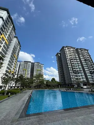 a swimming pool in the middle of two tall buildings at Pillow Talk HQ in Gua Sai