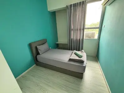 a small room with a bed and a window at Pillow Talk HQ in Gua Sai