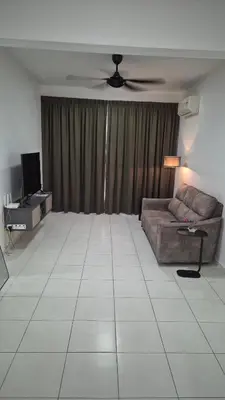 a living room with a couch and a ceiling fan at Hide-out in Tanjong Tokong