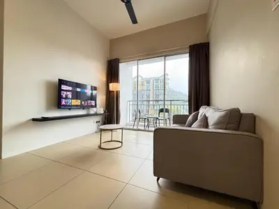 a living room with a couch and a large window at JS Comfortable Stay Golden Hills Pasar Malam 3Bedrooms 2Bathrooms in Brinchang