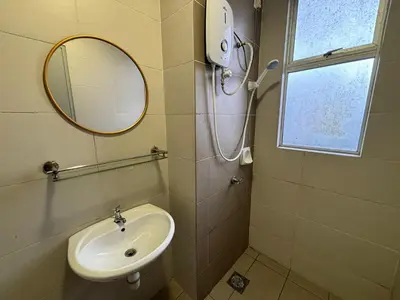 a bathroom with a sink and a mirror at JS Comfortable Stay Golden Hills Pasar Malam 3Bedrooms 2Bathrooms in Brinchang