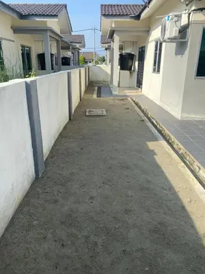 an empty driveway in front of a house at Homestay ZAF sitiawan in Sitiawan