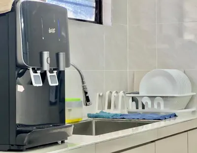 a kitchen counter with a mixer next to a sink at Spacious 2 Storey Homestay Tanjung Bungah 25Pax by 3C in Tanjung Bungah