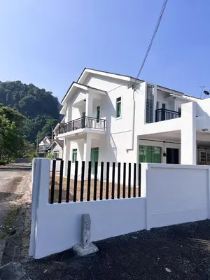 a white building with a fence in front of it at Lake Grove 17 near Tambun 4BR - 8 PAX in Kampong Batu Lapan