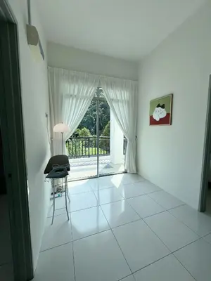 a white room with a chair and a window at Lake Grove 17 near Tambun 4BR - 8 PAX in Kampong Batu Lapan