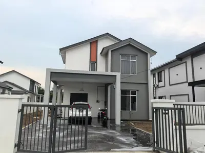a white house with a gate and a driveway at Padang Serai Wangi Roomstay 95 in Padang Serai