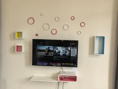 a flat screen tv hanging on a wall at Padang Serai Wangi Roomstay 95 in Padang Serai
