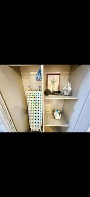 a room with white shelves and a wall at Cybersquare Vertex Tower in Gua Sai
