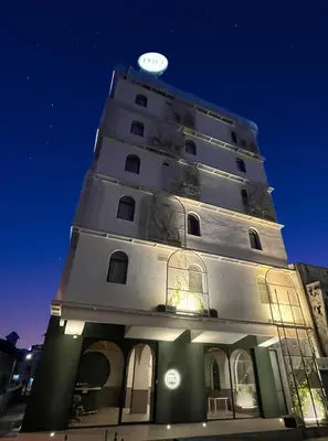 a tall building with a clock on top of it at mu petite in Ipoh
