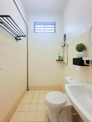 a bathroom with a toilet and a sink at BM Alma AutoCity Aeonjusco in Bukit Mertajam