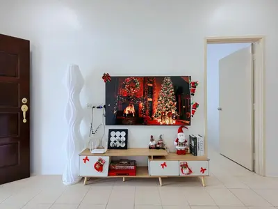 a living room with a christmas tree and a table at BM Alma AutoCity Aeonjusco in Bukit Mertajam