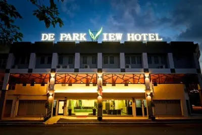 a large hotel with a sign on top of it at De Parkview Hotel in Ipoh