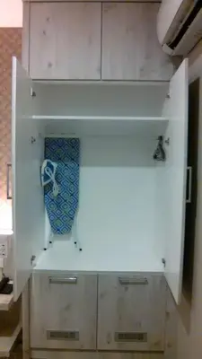 a white cabinet with a tie on top of it at De Parkview Hotel in Ipoh