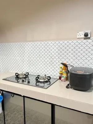 a stove top with a pot on top of it at Homestay Taman Scientex Kota Tinggi in Gua Sai