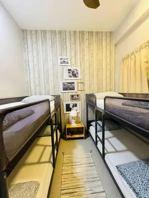 a room with three bunk beds in it at Kareena Barrington Square Goldenhills Pasar Malam Cameron Highlands in Brinchang