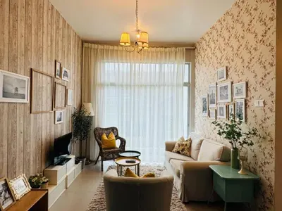 a living room with a couch and a chair at Kareena Barrington Square Goldenhills Pasar Malam Cameron Highlands in Brinchang