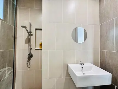 a bathroom with a sink and a shower at Sky Pool Luxury Stay Sea View Bayan Airport in Bayan Lepas