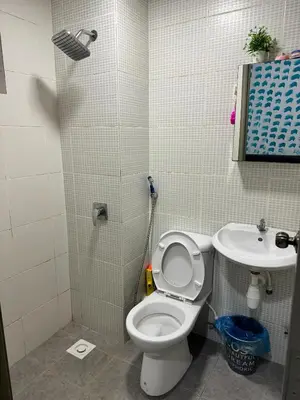 a bathroom with a toilet and a sink at AYAAN Nova PingPong House Free Parking in Tanah Rata