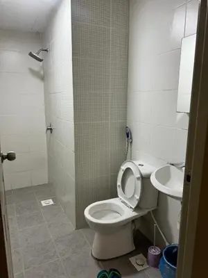 a bathroom with a toilet and a sink at AYAAN Nova PingPong House Free Parking in Tanah Rata