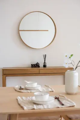 a dining room table with a mirror on the wall at Serene Japandi Family Retreat 2-6 pax& Sunrise View in Brinchang