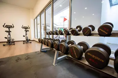 a row of wine bottles on display in a gym at Serene Japandi Family Retreat 2-6 pax& Sunrise View in Brinchang