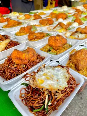 a bunch of dishes of food on a table at Lily Studio in Brinchang