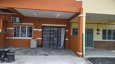 a front door of a building with a garage at Anjung Vacation Home No 70 in Gua Sai