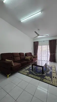 a living room with a couch and a coffee table at Anjung Vacation Home No 70 in Gua Sai