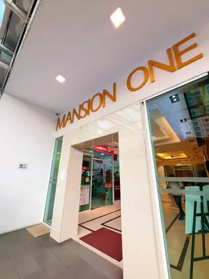 a mission one sign on the side of a store at Mansion One studio in George Town