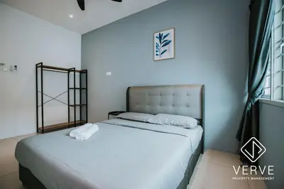 a bedroom with two beds and a mirror on the wall at Ipoh Lazy Private Club House 4B3B by Verve 14 pax in Tambun
