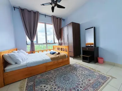 a bedroom with a bed with a ceiling fan and a mirror at PPAM Seruling Presint 5, Putrajaya 4BR with PICC View and Garden View Homestay