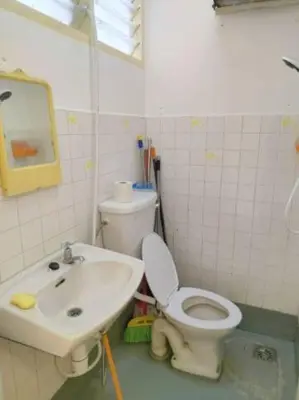 a bathroom with a toilet and a sink at Comfy Room Near to Penang Bridge in George Town