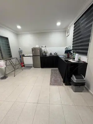 a kitchen with a sink and a counter in a room at Peruda Inn - Homestay for Múslim only in Sungai Petani