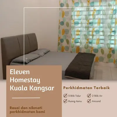 a picture of a bedroom with a bed and a sign at Eleven Homestay Kuala Kangsar in Kuala Kangsar
