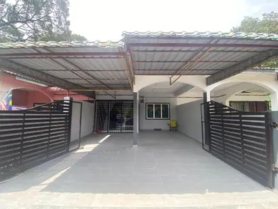 a patio with a wooden gate and a fence at Homestay Bonda E in TanjongMalim